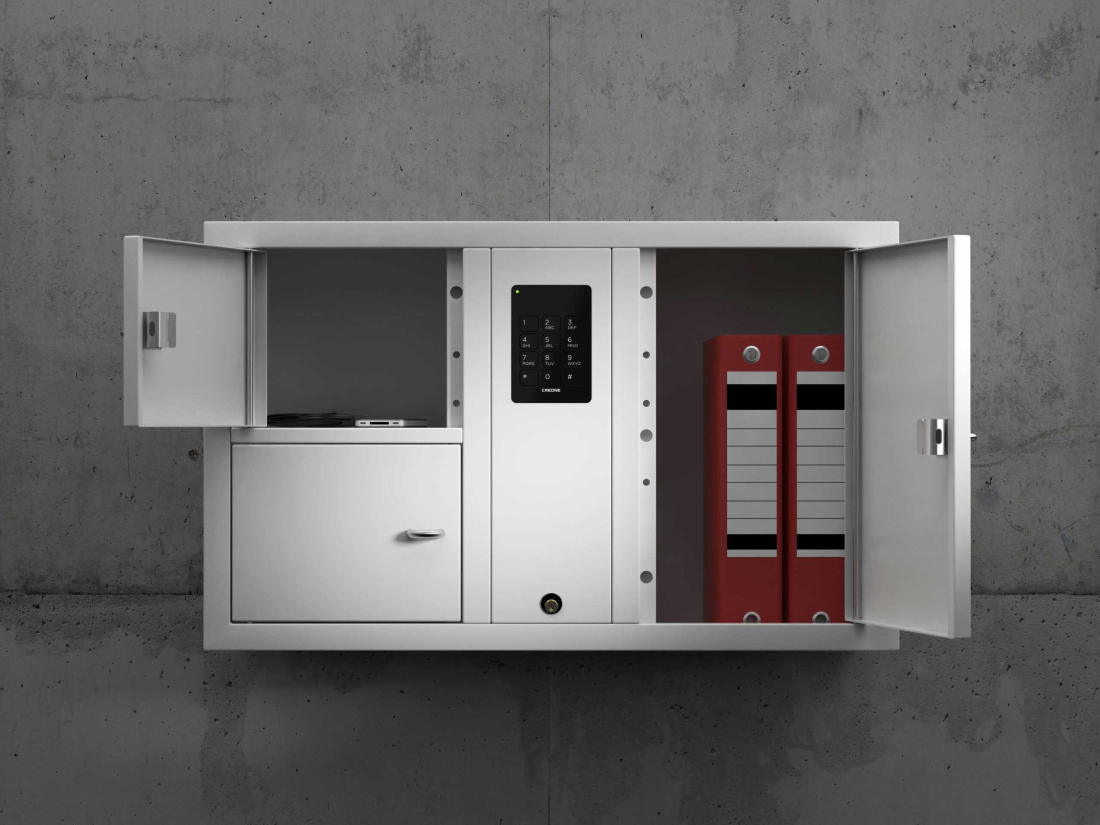 Valuables cabinet 7003 S in the System series. Mounted on the wall with open compartments containing folders, telephone and wallet.